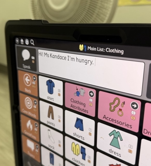 An AAC device screen showing the message: Hi Ms Kandace, I'm hungry.